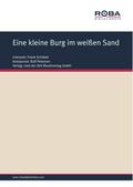 Eine kleine Burg im weißen Sand