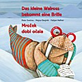 Das kleine Walross bekommt eine Brille