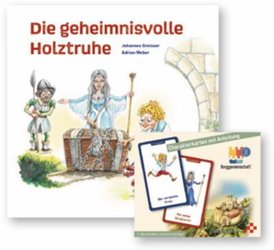 Buch ’Die geheimnisvolle Holztruhe’ und Charakterkarten ’Die Burggemeinschaft’